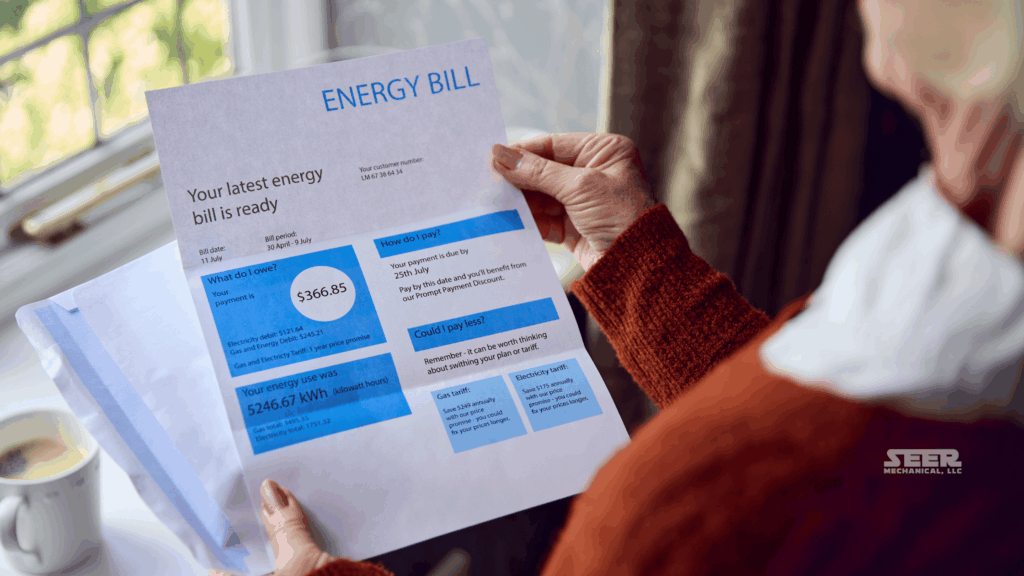 Homeowner reviewing a high energy bill, highlighting the need for smart HVAC upgrades.
